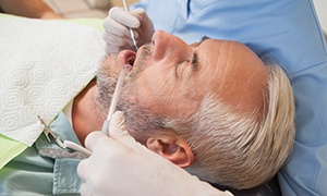 Man undergoing gum disease treatment